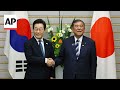 South Koreas new president visits Japan before summit with Trump