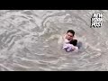 Man rescues girl from fast flowing river, viral video
