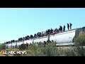 Mexico freight trains halts service after hundreds of migrants hitch rides to border