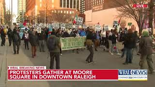 Protesters march in downtown Raleigh in opposition to Donald Trump's inauguration