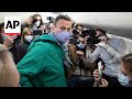 Archive video shows Alexei Navalny being detained in Moscow on plane