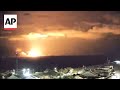 Large explosions turn night sky over Gaza Strip orange as conflict continues
