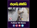 Traffic Police Clear Waterlogged Road By Unclogging Drain | KPHB | V6 News