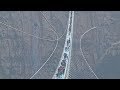 World's longest glass-bottom bridge opens in north China-Exclusive video