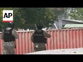 Gunbattle erupts between police and gangs in Haiti near the National Palace