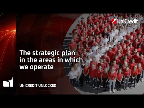 Overhead photo of people wearing red and white T-shirts and arranged to form the UniCredit logo