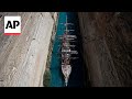 The Olympic flame crosses the Corinth canal en route to Marseille