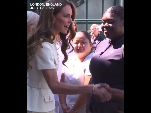 UK's Princess Kate shaking hands with Wimbledon players as she arrives for women's final
