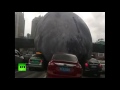 Pedestrians shocked at 'furious moon' rolling along across Chinese streets