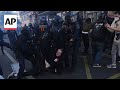 Police fire tear gas at protesters in Paris protesting against Macron