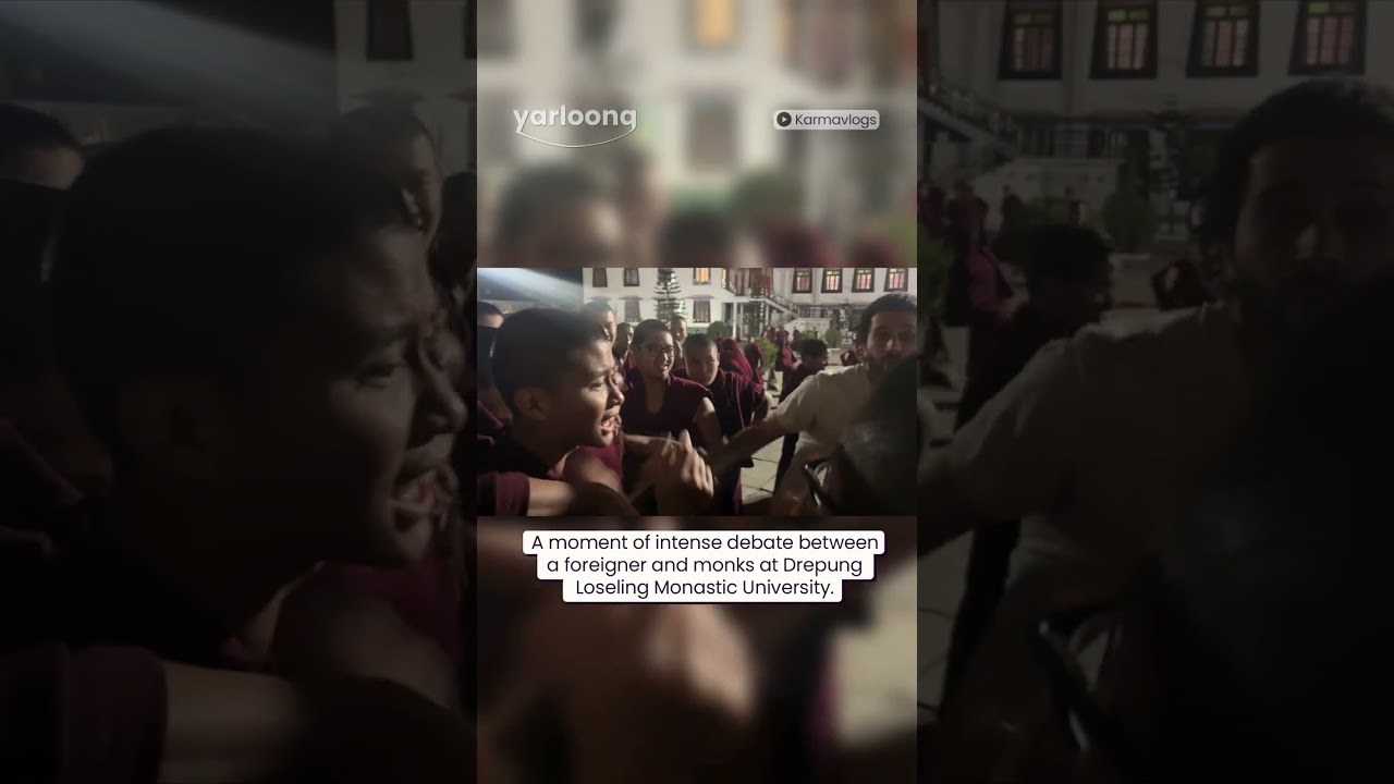 A moment of intense debate between a foreigner and several monks