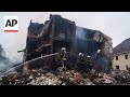 Residents of village near Kyiv react after Russian attack hits their homes
