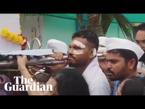 Sole India plane crash survivor mourns his brother during funeral