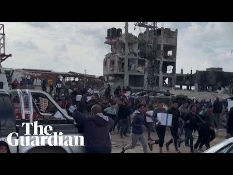 Chaotic scenes during aid distribution in Gaza City as residents flee gunfire