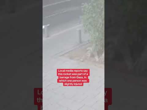 CCTV shows Tel Aviv pedestrians narrowly avoiding a piece of a rocket shot down over city