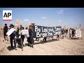 Protesters in Israel march towards the Gaza border demanding end to the war