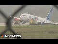 United Airlines plane rolls off runway at Houston airport