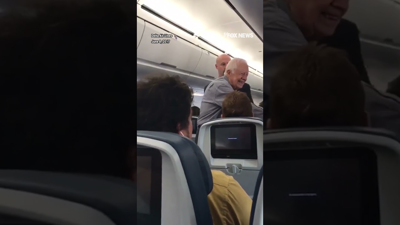 Flashback: Former President Jimmy Carter shakes hands with every passenger on Delta flight