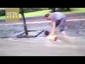 Watch : Pedestrian catches child from being swept away by floodwater