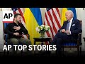 Biden and Zelenskyy meet in France; Putin talks about clash with West | AP Top Stories