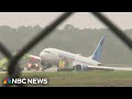 Runway shut down after United plane slides into grass