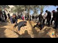 Gazans dig multiple graves at Khan Younis hospital  - 01:20 min - News - Video