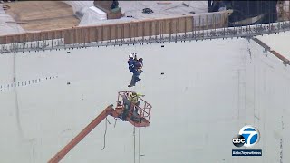 Workers rescued by chopper after construction site collapse