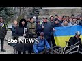 Demonstrators sing Ukrainian anthem in Melitopol