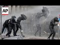 Police clash with protesters in France as Macron installs a new PM