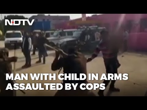 Policemen thrash man with child in arms, video creates buzz on social media