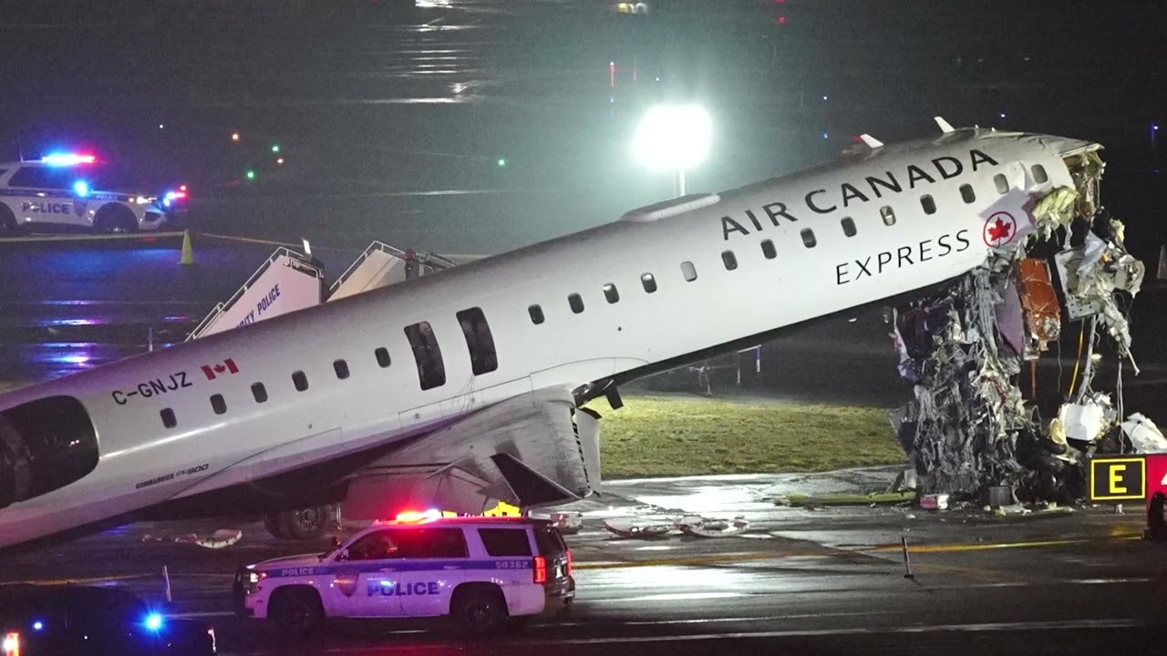 Pilots killed as Air Canada jet hits fire truck at New York's LaGuardia airport