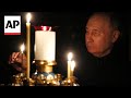 Putin visits church and places candles for victims of Moscow attack