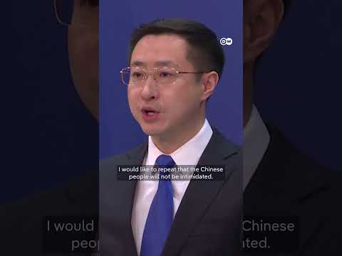 China: We 'will not be intimidated' after US tariffs take effect | DW News