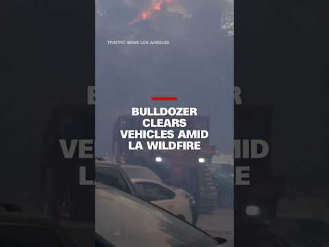 Bulldozer clears vehicles amid LA wildfire