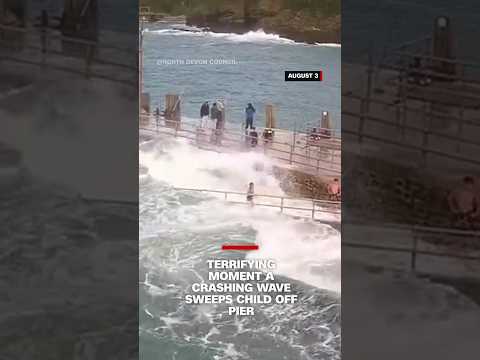 Terrifying moment a crashing wave sweeps child off pier