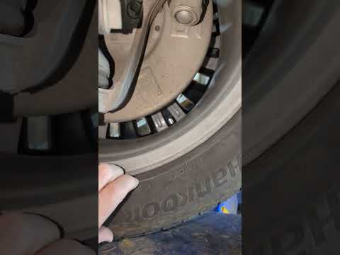 Tesla Model Y wheel inspection after hitting big potholes