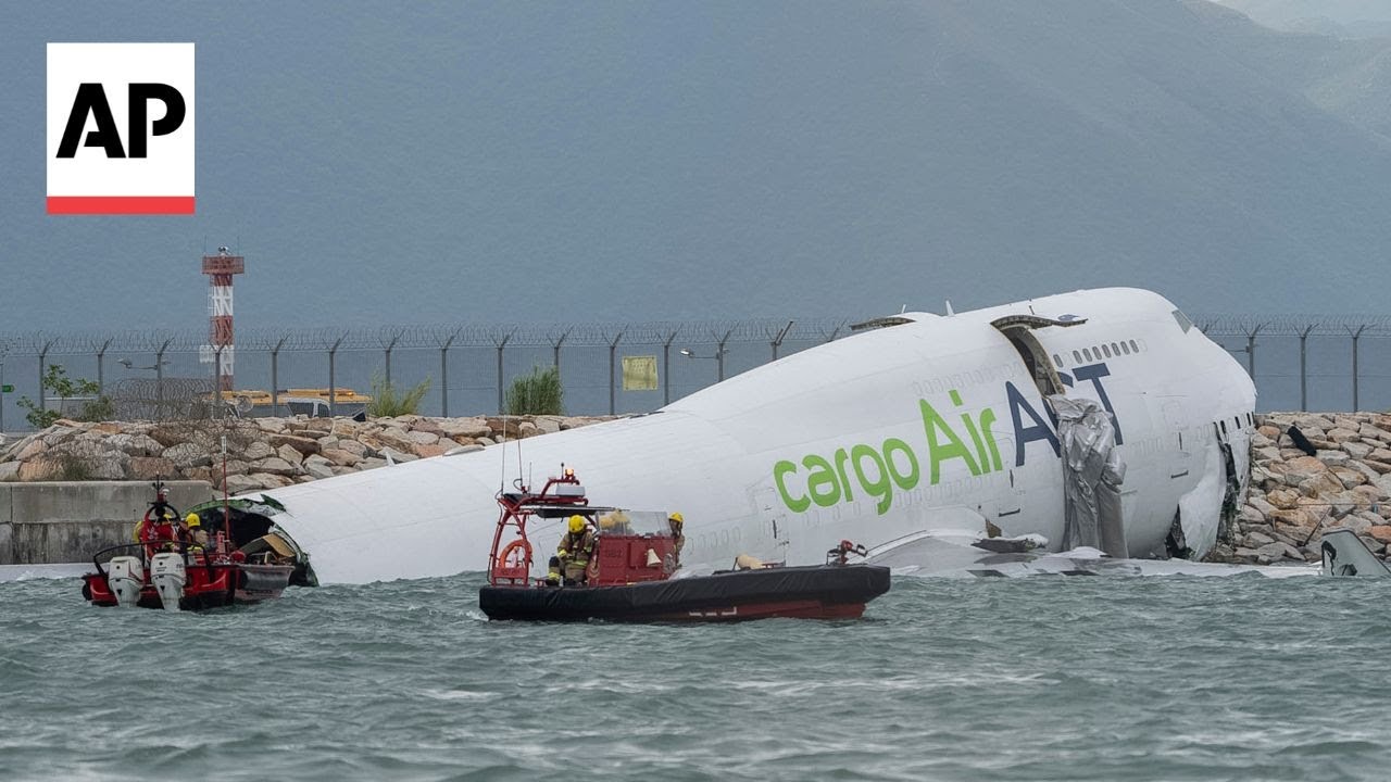 Cargo plane skids off Hong Kong runway into sea during landing, killing 2 people