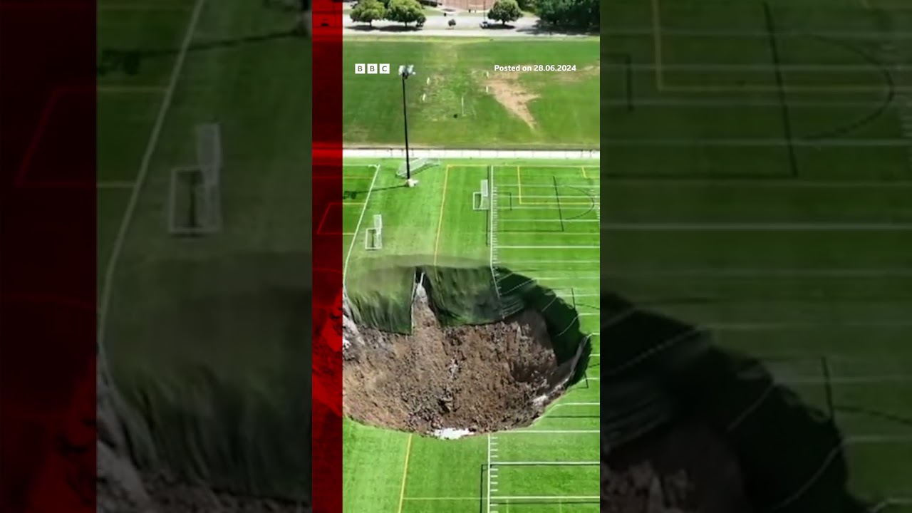 Watch moment sinkhole swallows football pitch leaving a 100 feet wide (30.5m) hole. #BBCNews