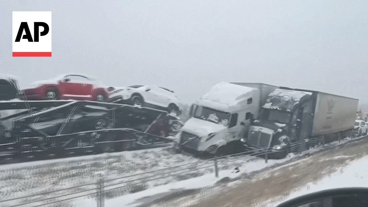 Cars and trucks stuck on snow-covered I-70 in Missouri