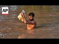 Stranded people rescued by boat in Pakistans flood-hit Punjab province