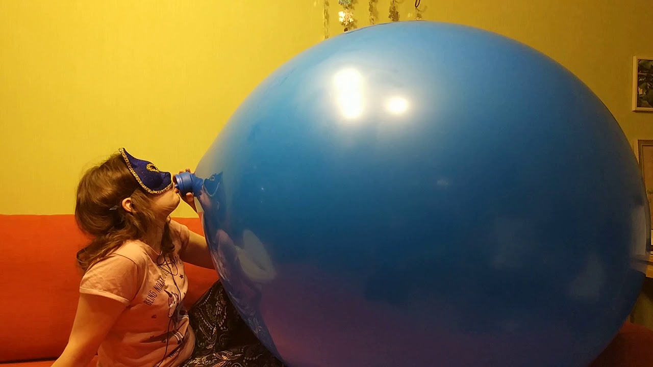 Girl Blowing Balloons