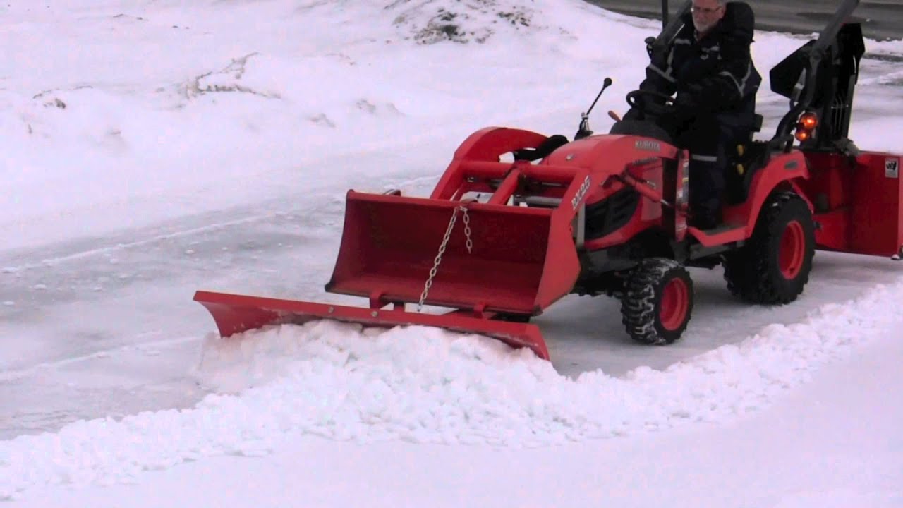 Snow blower, plow and bucket on Kubota BX clearing hard snow - YouTube
