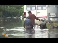People and dogs wade through knee-deep water in Chennai | News9