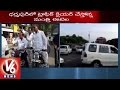 V6 - Harish Rao, Etela ride bike to clear traffic at Dharmapuri
