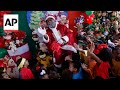 Black Santa brings Christmas cheer to Rio de Janeiro in Brazil